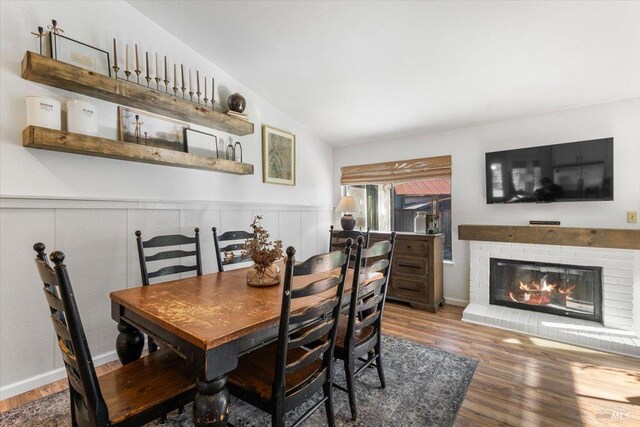 kitchen with appliances with stainless steel finishes, tile countertops, white cabinets, and kitchen peninsula