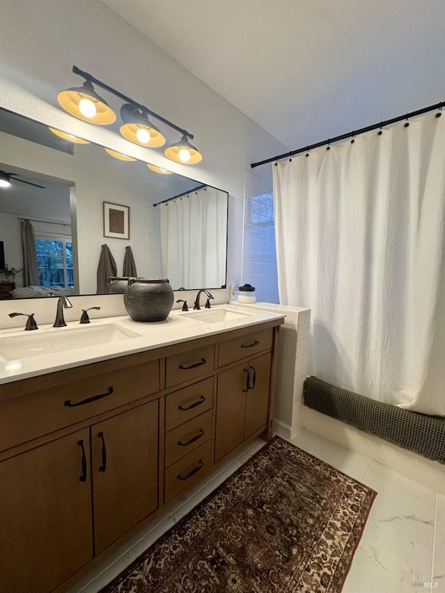 bathroom featuring vanity and shower / tub combo