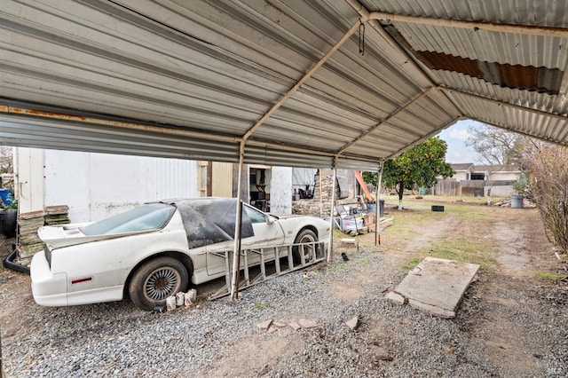 view of vehicle parking featuring a carport