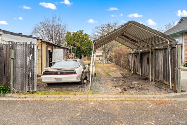 view of parking / parking lot with a carport