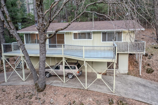 rear view of house featuring a carport