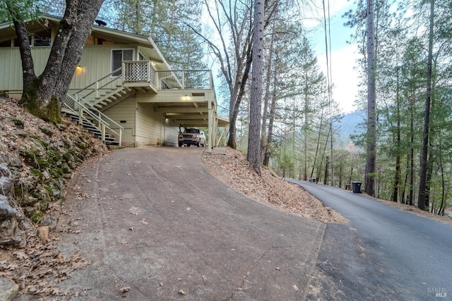 view of side of property featuring a carport