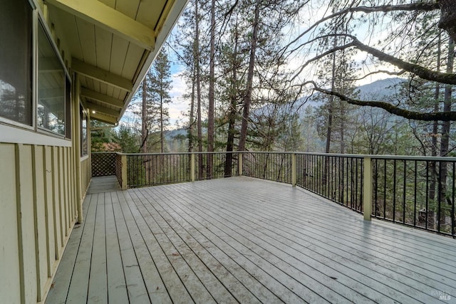 wooden terrace featuring a mountain view