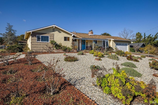 ranch-style home with a garage