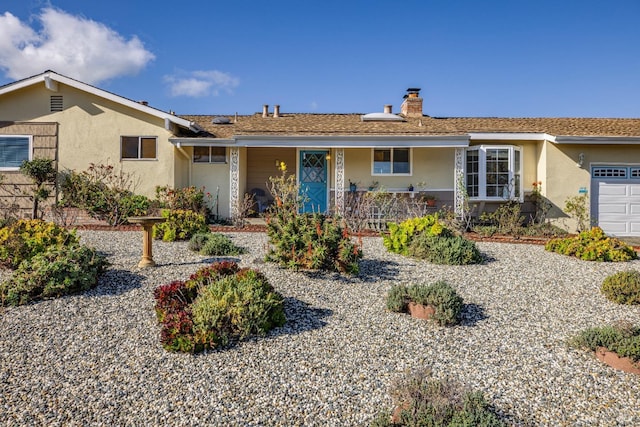 single story home featuring a garage