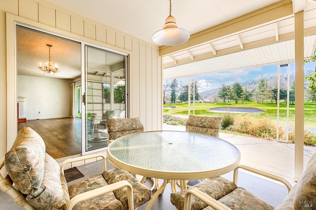 interior space featuring a wealth of natural light and a notable chandelier