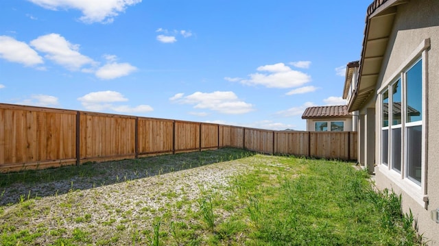 view of yard featuring a fenced backyard