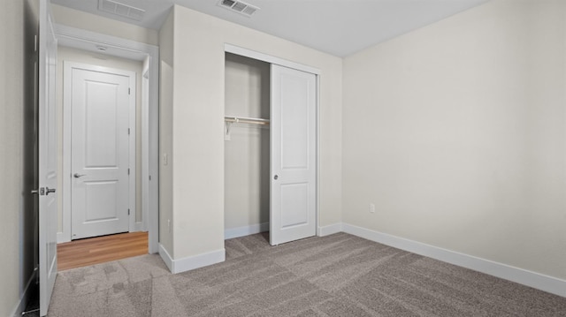 unfurnished bedroom featuring a closet, visible vents, and baseboards