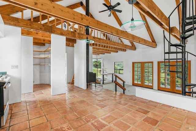 interior space with beamed ceiling, ceiling fan, high vaulted ceiling, and french doors