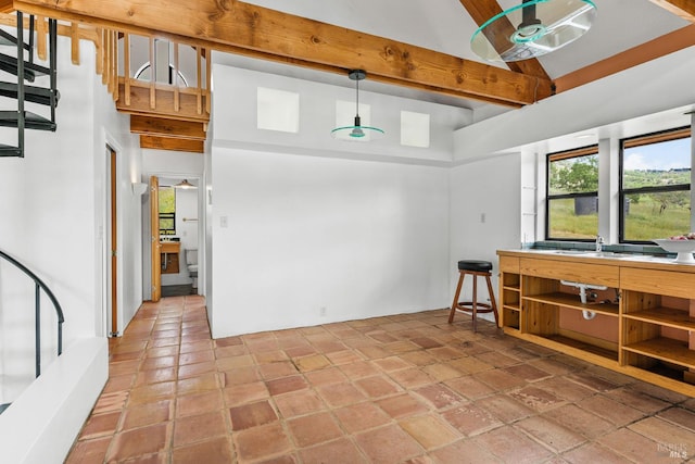 interior space featuring beam ceiling