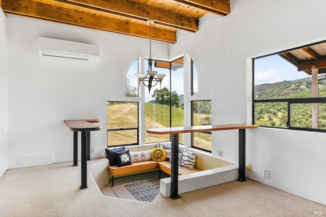 interior space featuring wood ceiling, beam ceiling, a wall unit AC, a mountain view, and a chandelier