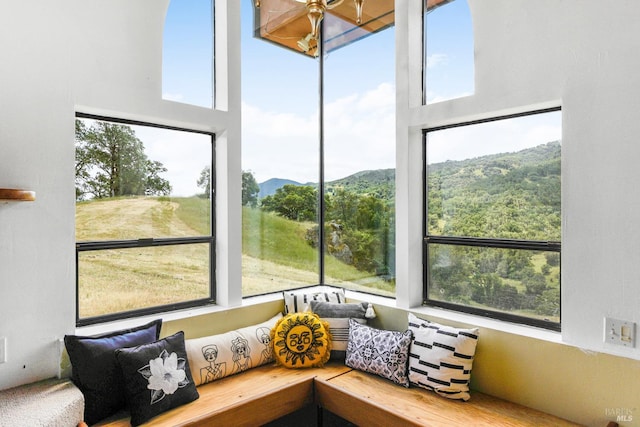 sunroom with a mountain view