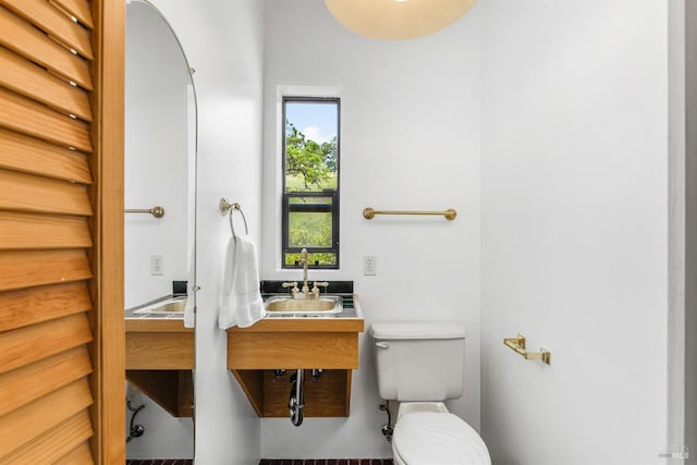 bathroom with sink and toilet