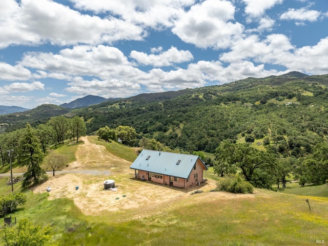 drone / aerial view with a mountain view and a rural view