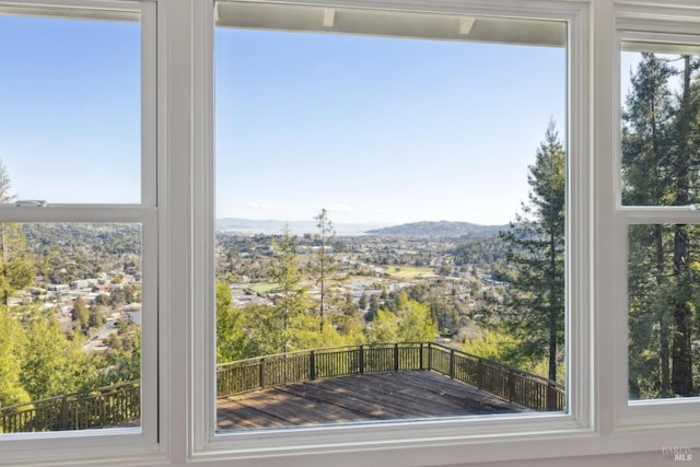 unfurnished sunroom with a mountain view