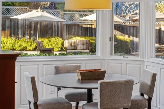 sunroom / solarium featuring breakfast area