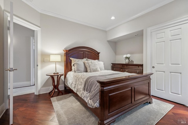 bedroom with crown molding and dark hardwood / wood-style floors