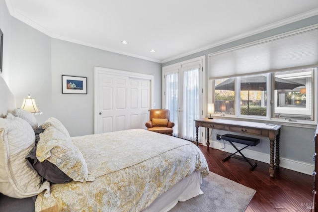 bedroom with ornamental molding and dark hardwood / wood-style flooring