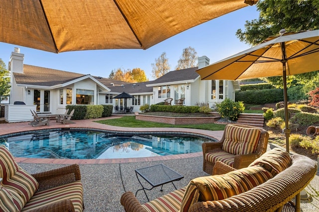 view of swimming pool with french doors, an outdoor hangout area, and a patio area