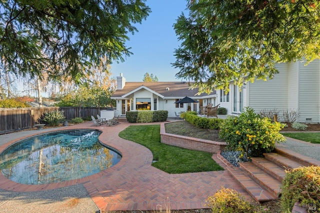 view of swimming pool with a patio area