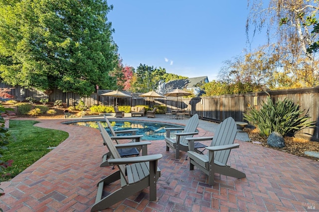 view of patio with a fenced in pool