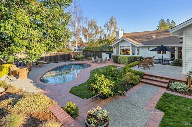 view of swimming pool featuring a patio area