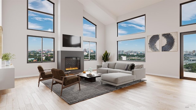 living room with a high ceiling and light wood-type flooring