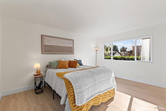 bedroom with light hardwood / wood-style flooring