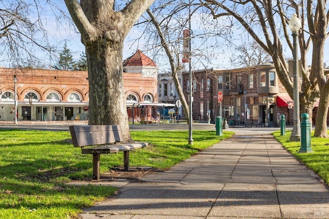 surrounding community featuring a lawn