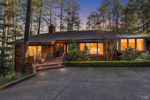 prairie-style home with a wooden deck