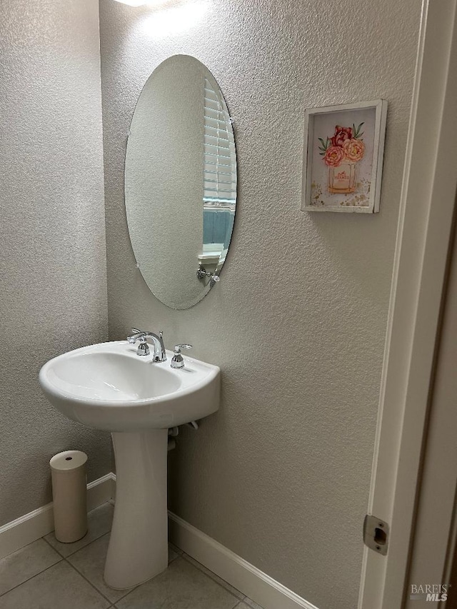 bathroom featuring tile patterned floors and sink