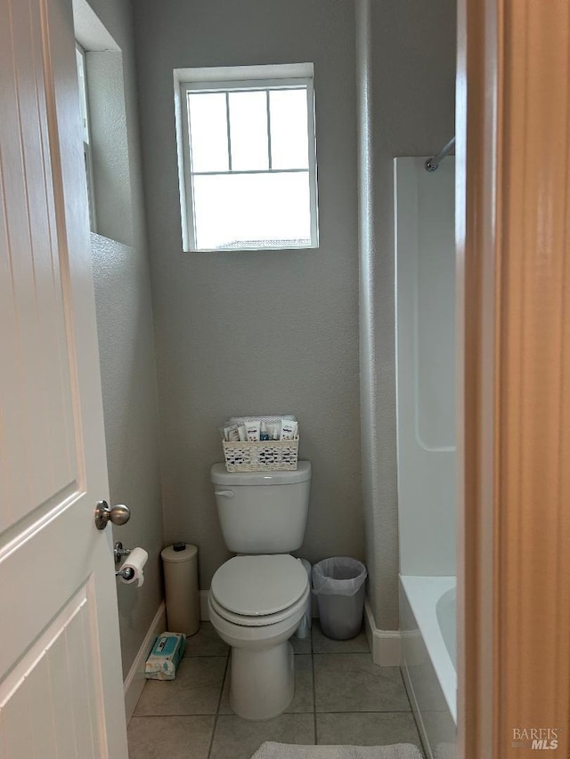 bathroom featuring tile patterned floors and toilet