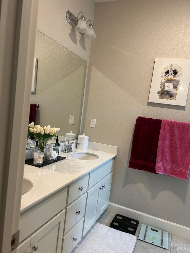 bathroom featuring tile patterned floors and vanity