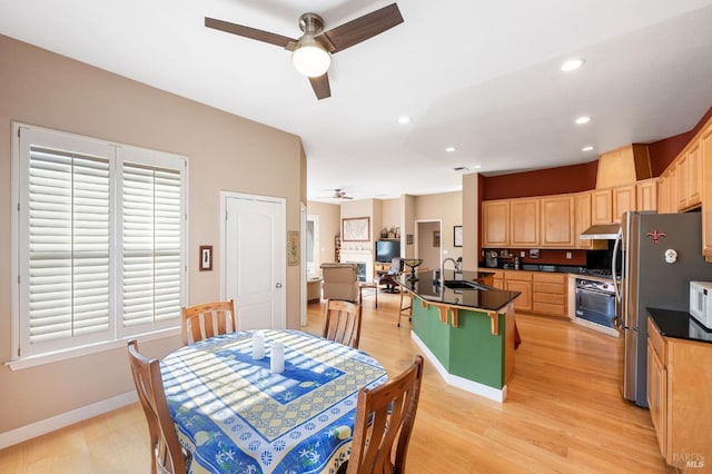 dining space featuring recessed lighting, baseboards, light wood-style flooring, and a ceiling fan