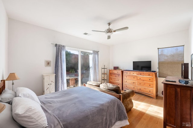 bedroom featuring visible vents, a ceiling fan, and light wood finished floors