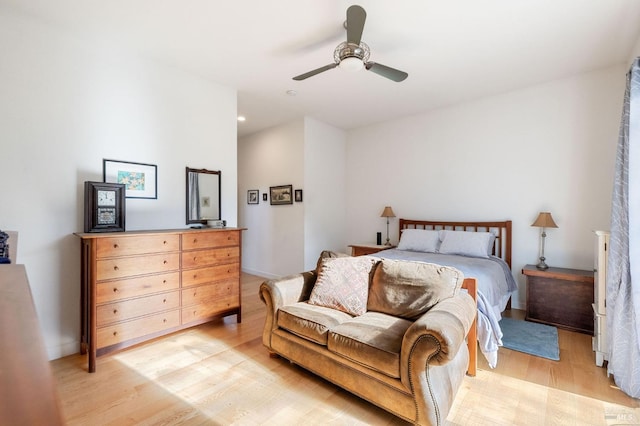 bedroom with a ceiling fan and wood finished floors