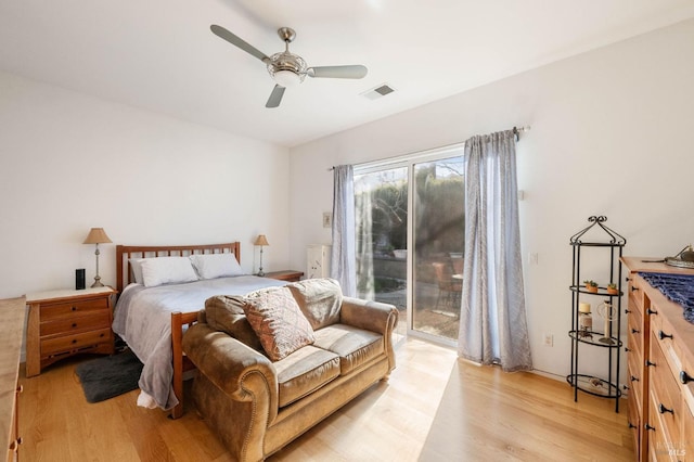 bedroom featuring a ceiling fan, access to outside, light wood-style flooring, and visible vents