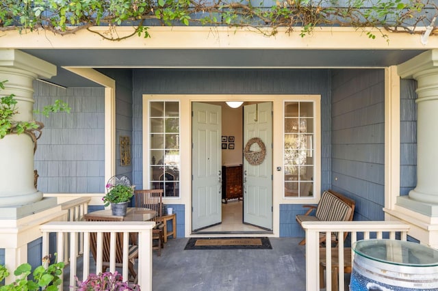 property entrance with covered porch