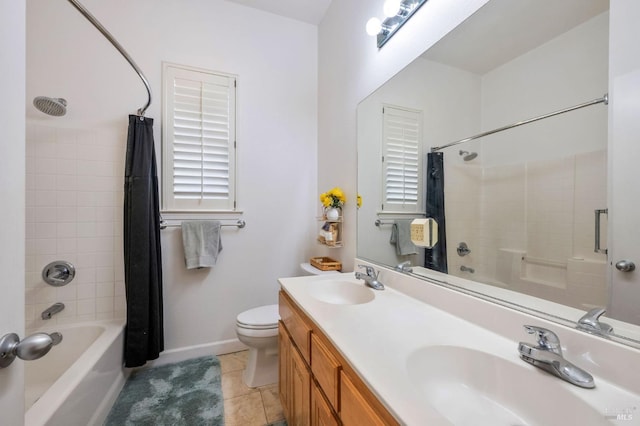 full bathroom featuring tile patterned floors, toilet, shower / bath combo, and a sink