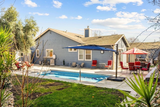 view of pool with a patio area and a fenced in pool