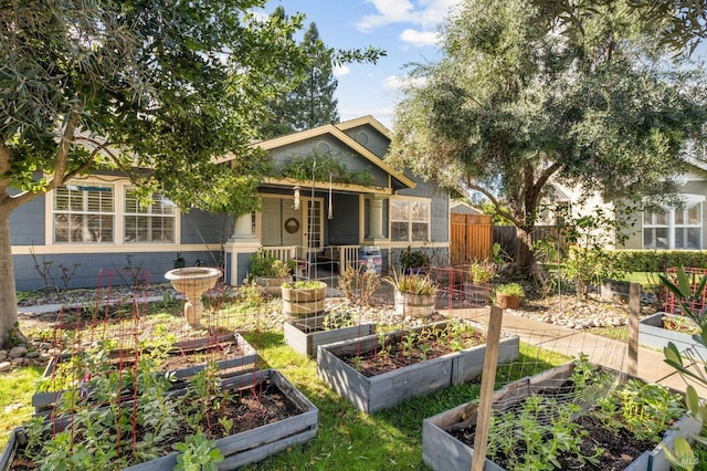 view of front of home featuring fence