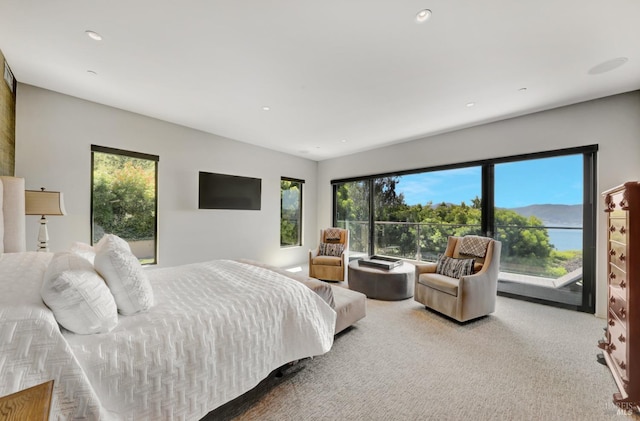 carpeted bedroom with recessed lighting and access to exterior