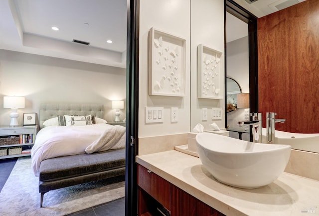 bathroom with vanity and tile patterned floors