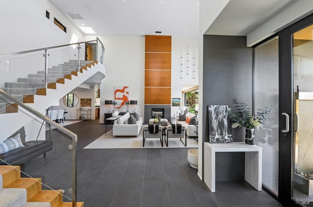 lobby featuring stairs and visible vents