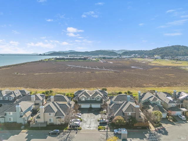 bird's eye view featuring a water and mountain view