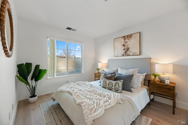 bedroom with light hardwood / wood-style floors