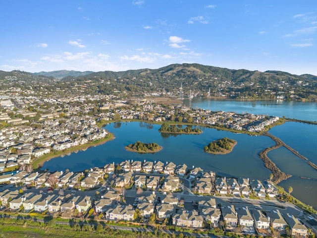 bird's eye view with a water and mountain view