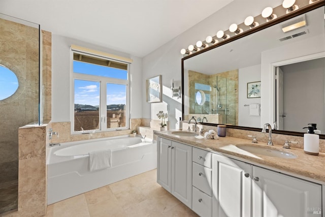 bathroom with vanity, shower with separate bathtub, and tile patterned floors