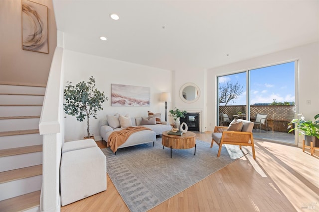 bedroom featuring light hardwood / wood-style floors and access to outside