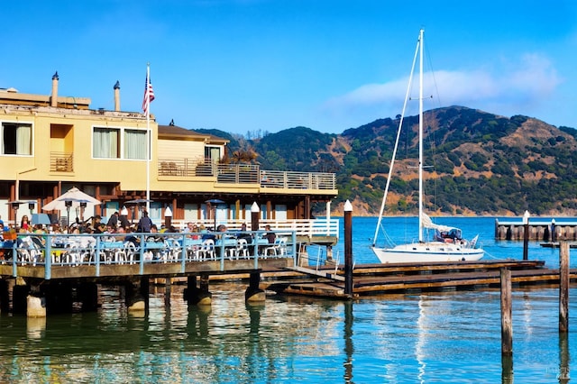 dock area with a water and mountain view